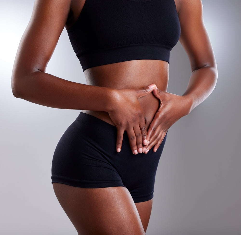 A woman holding her stomach