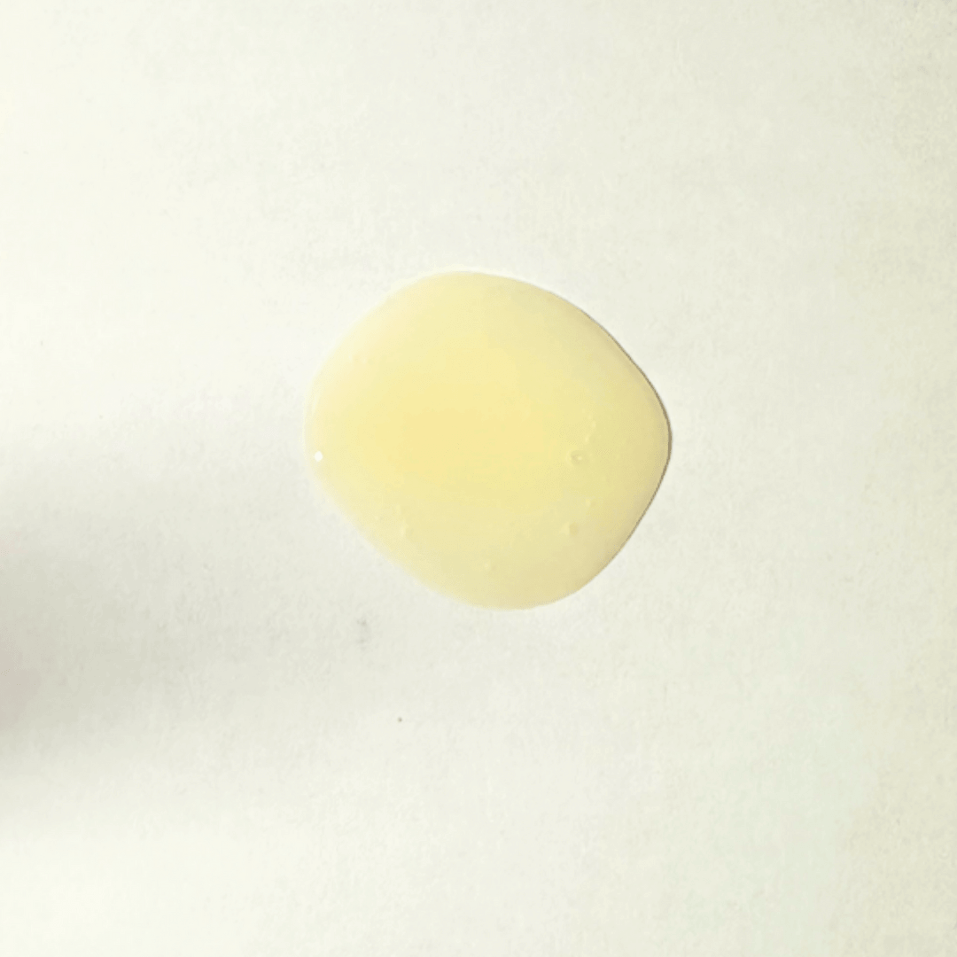 A glob of Cleanse Me Shampoo on a plain background