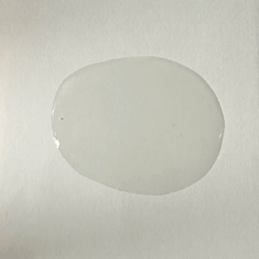 A glob of oil on a solid background