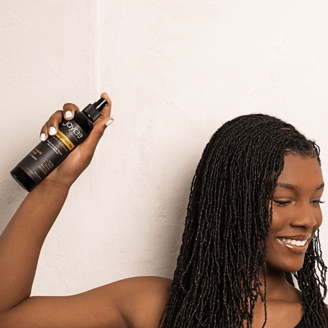 Woman spraying Strengthen Me in the air