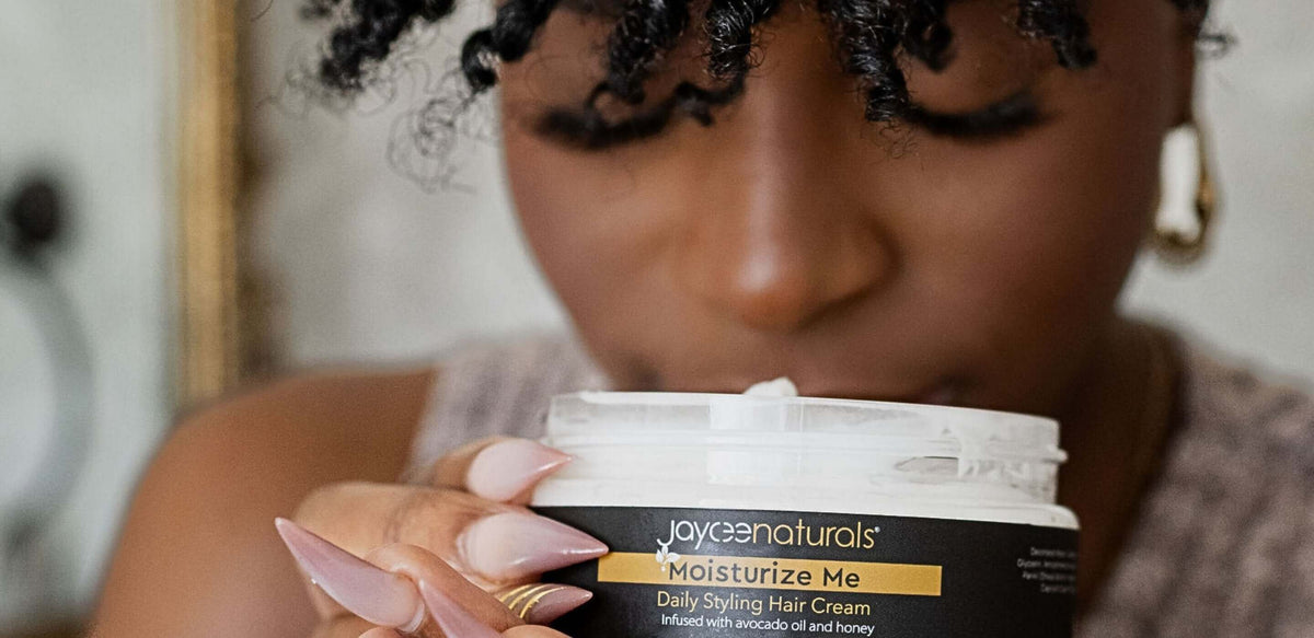 A woman smelling a hair cream product