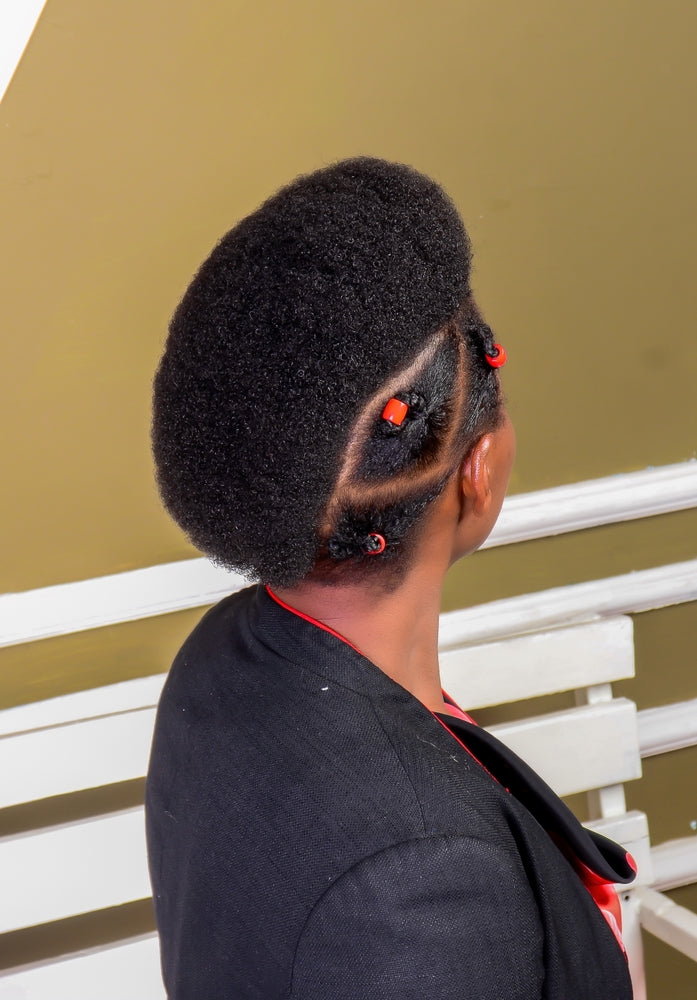 a woman with short 4c hair