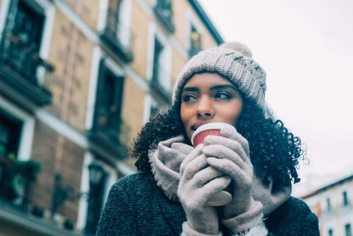 A woman with textured hair in the winter