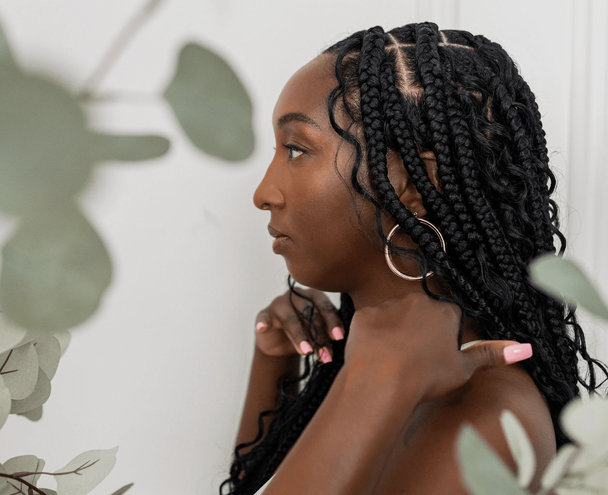Side profile of a woman with braids