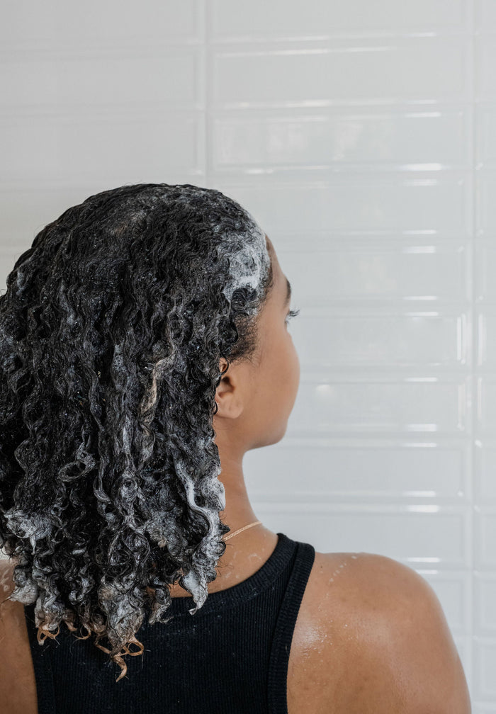 woman with sudsy hair
