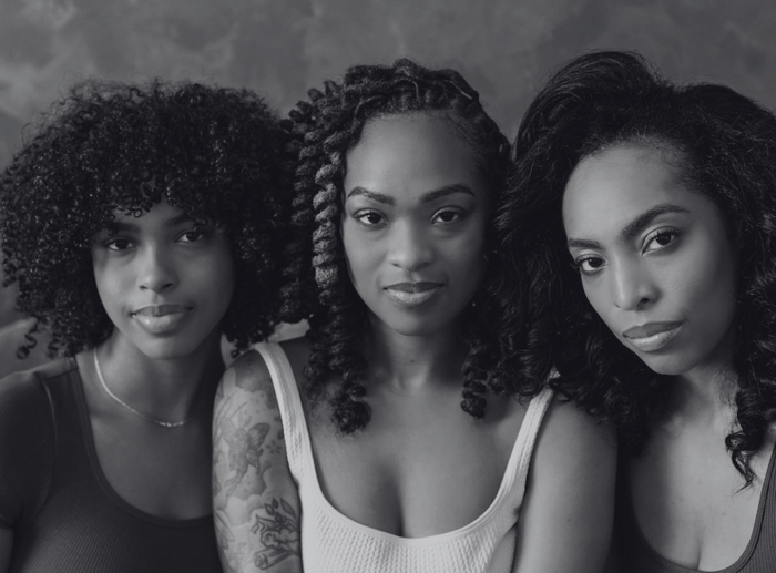 Up close view of 3 women facing the camera
