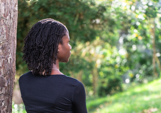 Back view of a woman with locs