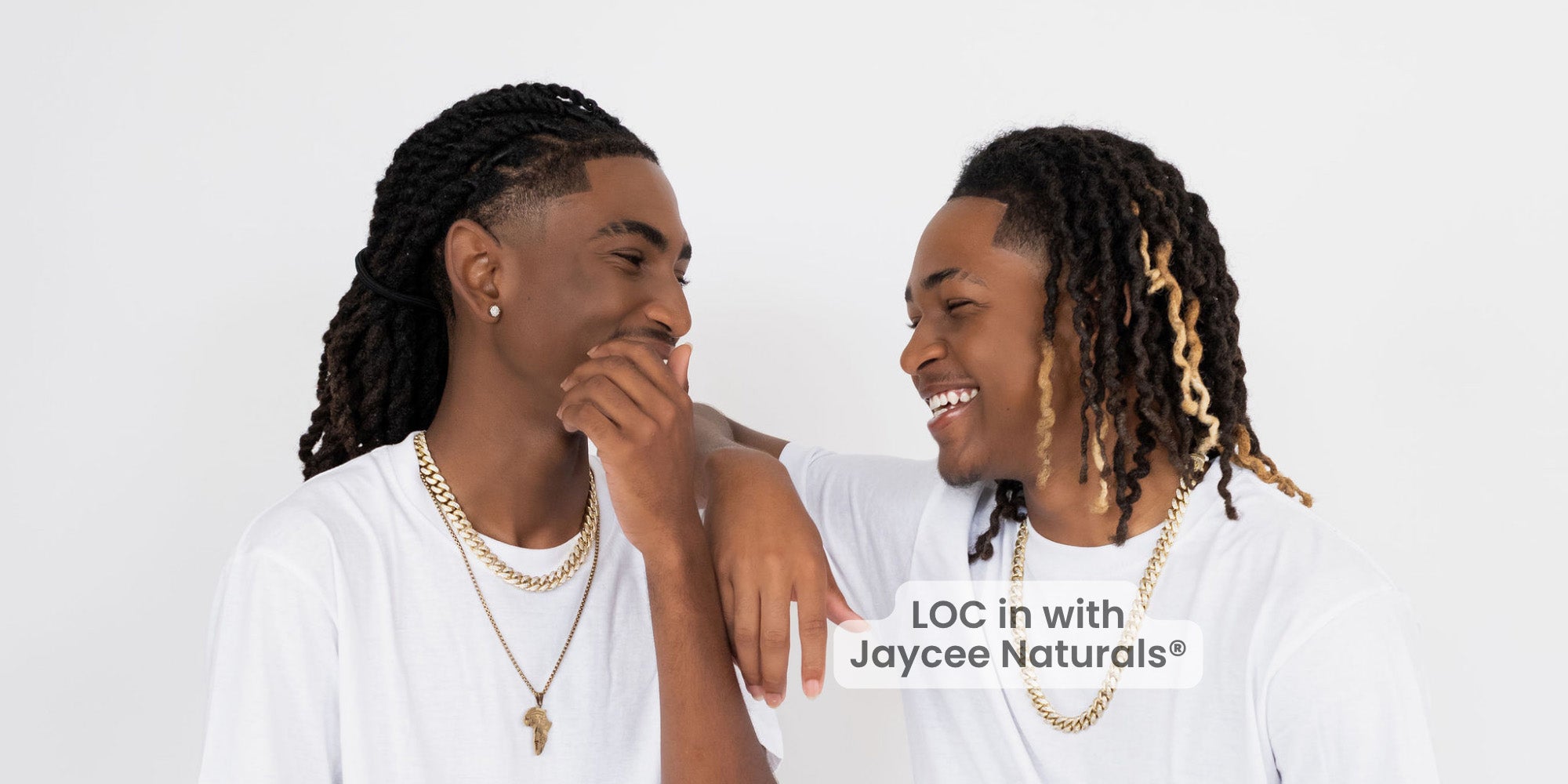 Two men with styled hair, wearing white shirts and gold necklaces, with 'Jaycee Naturals' branding.