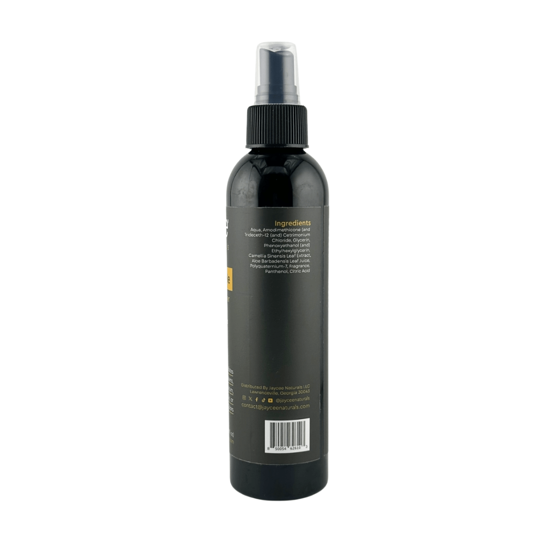 Jaycee Naturals Strengthen Me Leave-In Conditioner, back view. The label lists ingredients, including water, amodimethicone, and camellia sinensis leaf extract.