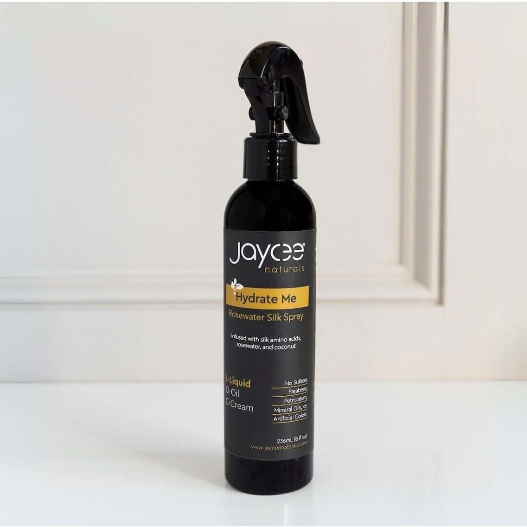 Hydrate me rosewater spray bottle on a white table