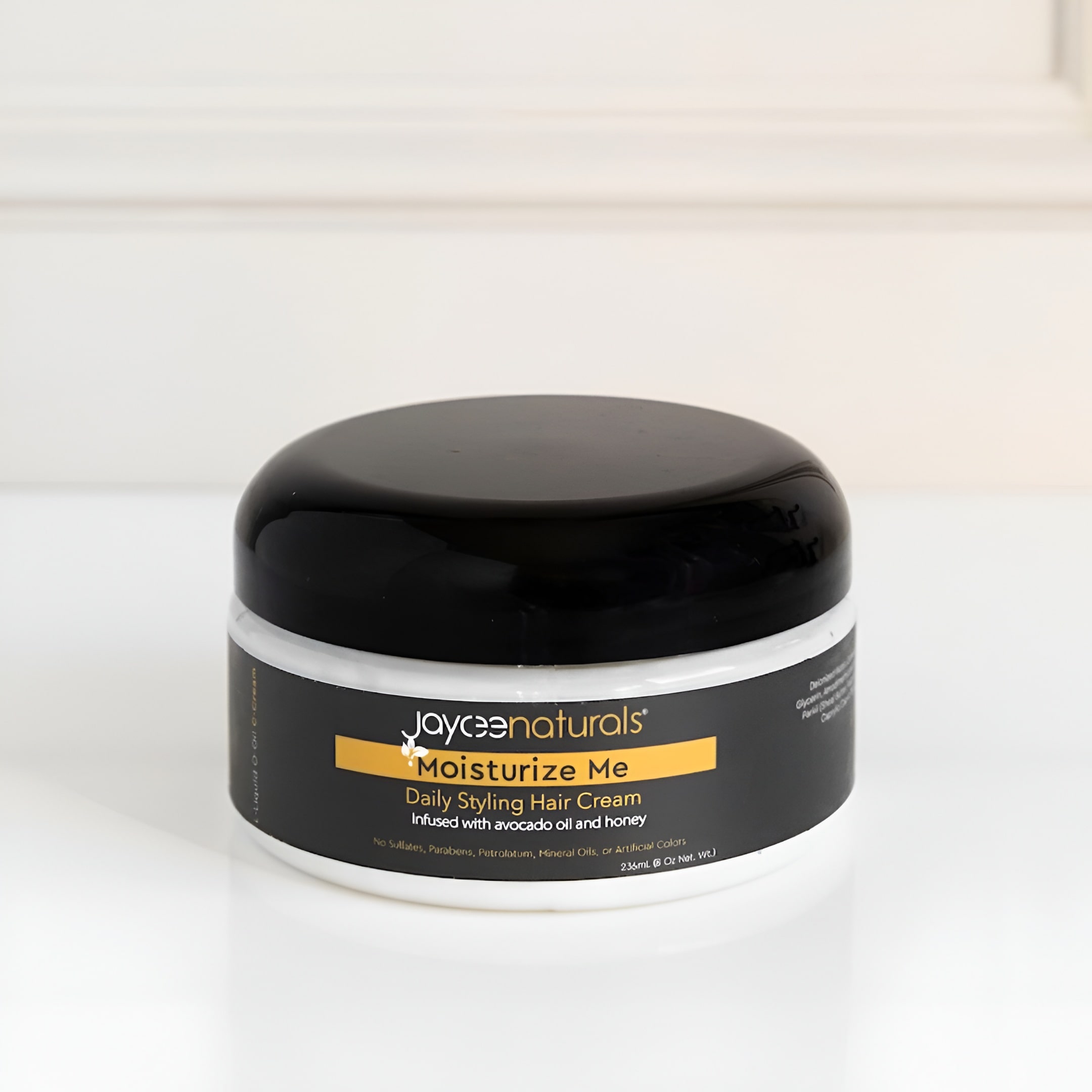 Jar of Jaycee Naturals Moisturize Me Daily Styling Hair Cream on a white background