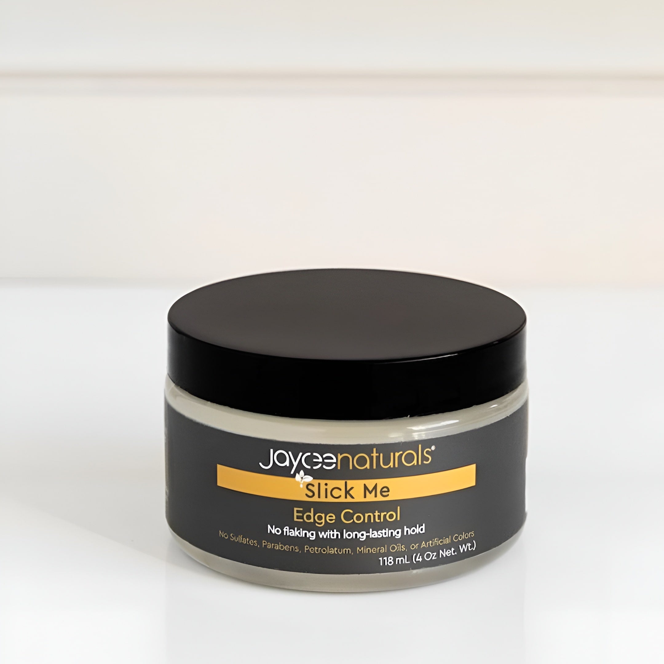 Jar of Jaycee Naturals Slick Me Edge Control on a white background